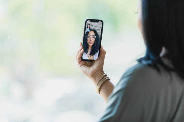 A client on a video styling session on her phone
